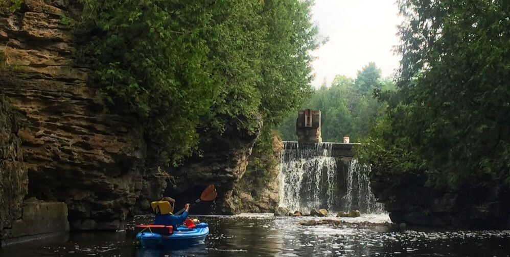 Kayaker near waterfall, Rockwood Conservation Area, Rockwood Ontario. Kayaking GTA, Kayak near toronto
